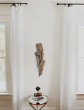 Found natural shaped Giraffe stone framed in driftwood and hanging in home decor